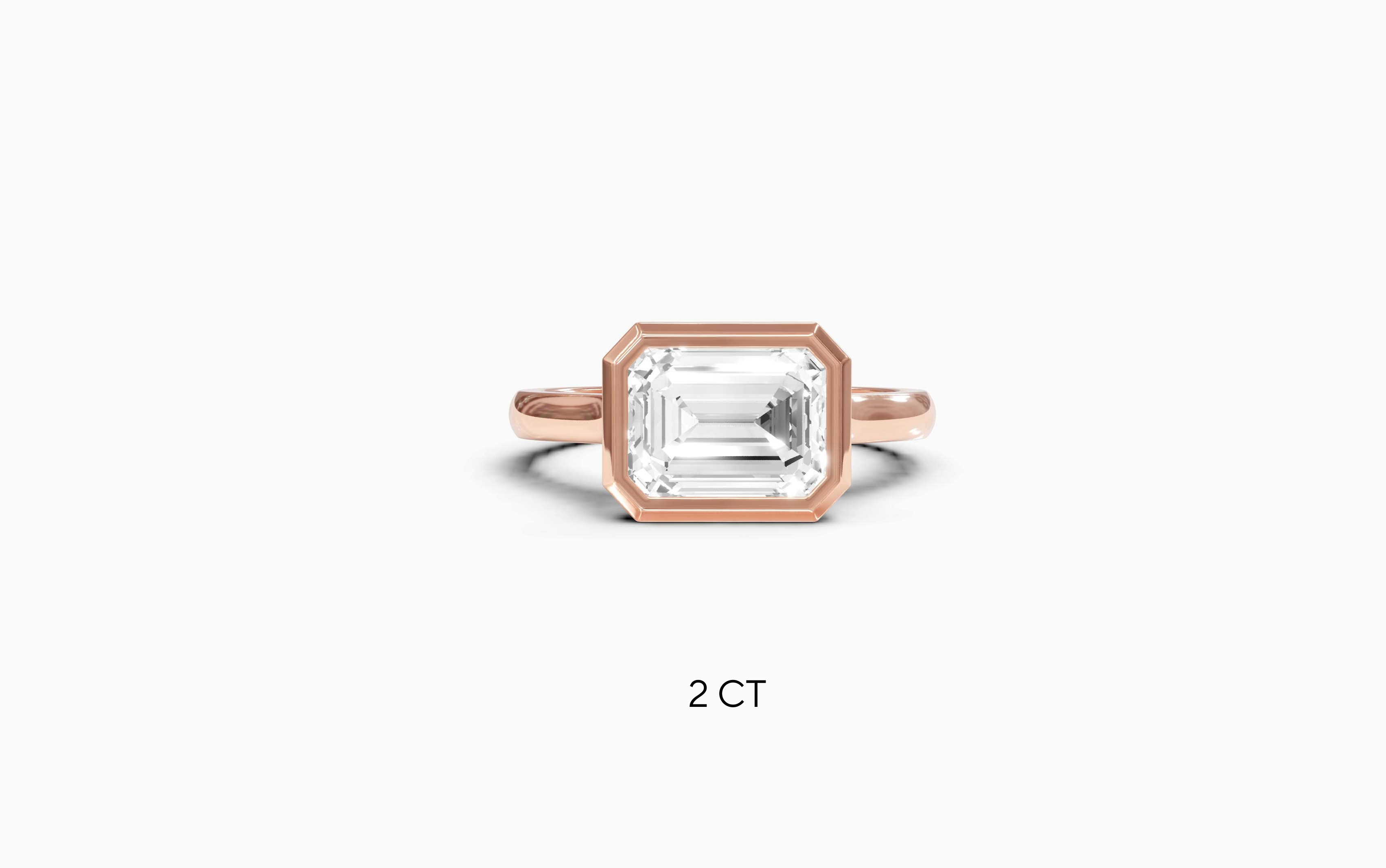 "It Girl" East-West Bezel Emerald Cut Solitaire Ring in Rose Gold