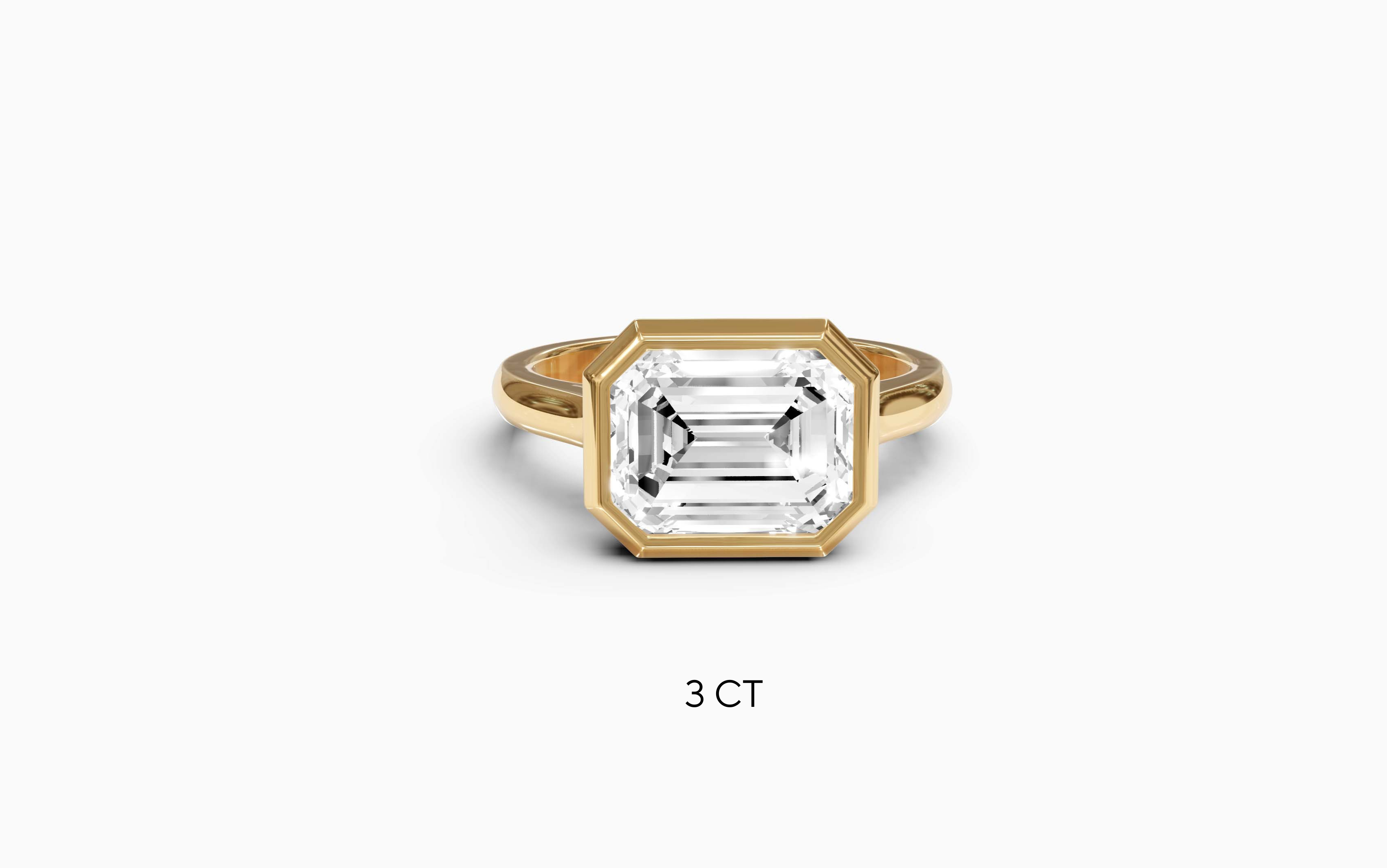"It Girl" East-West Bezel Emerald Cut Solitaire Ring in Yellow Gold
