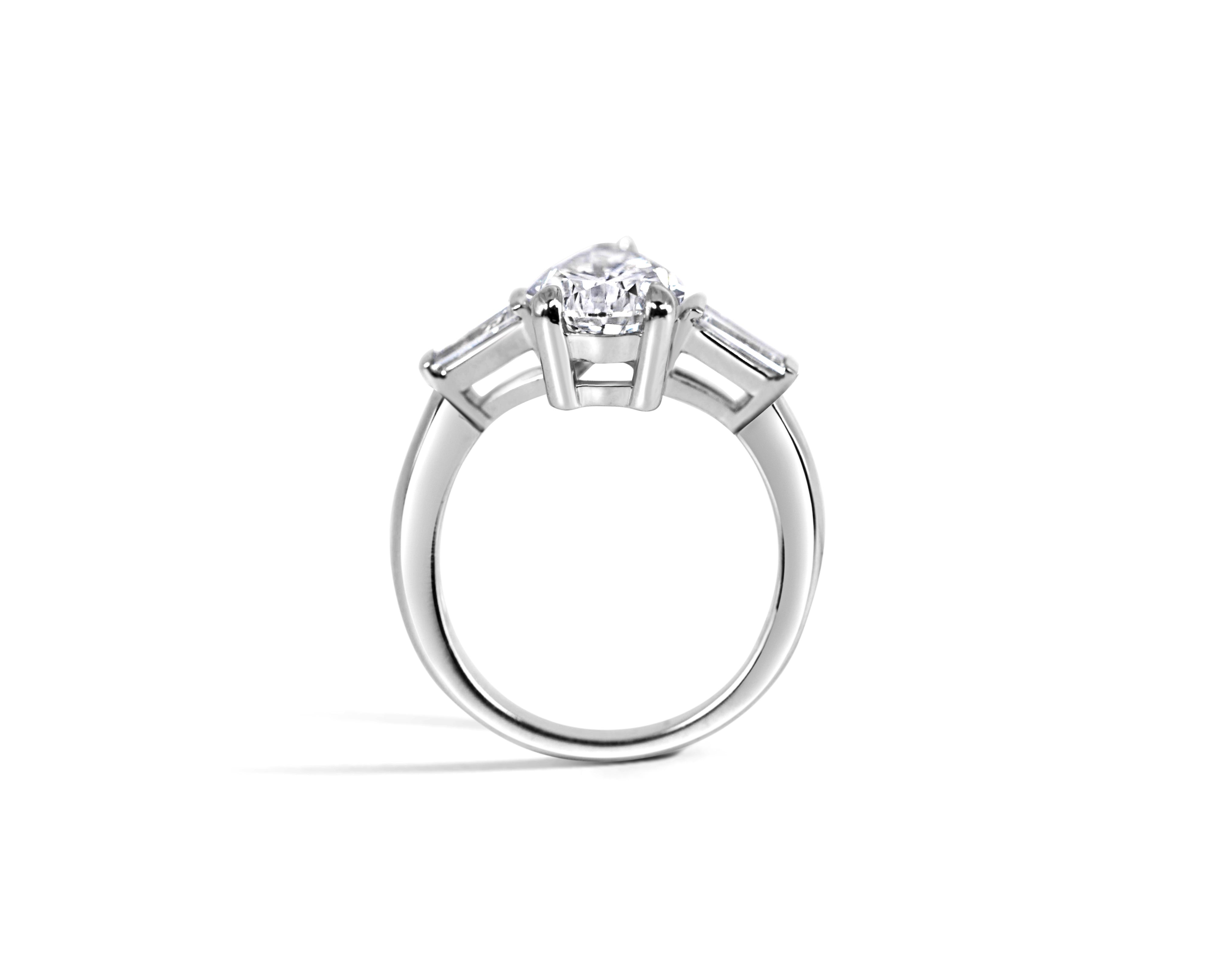 "Drop of Light" Pear and Tapered Baguette Three-Stone Ring