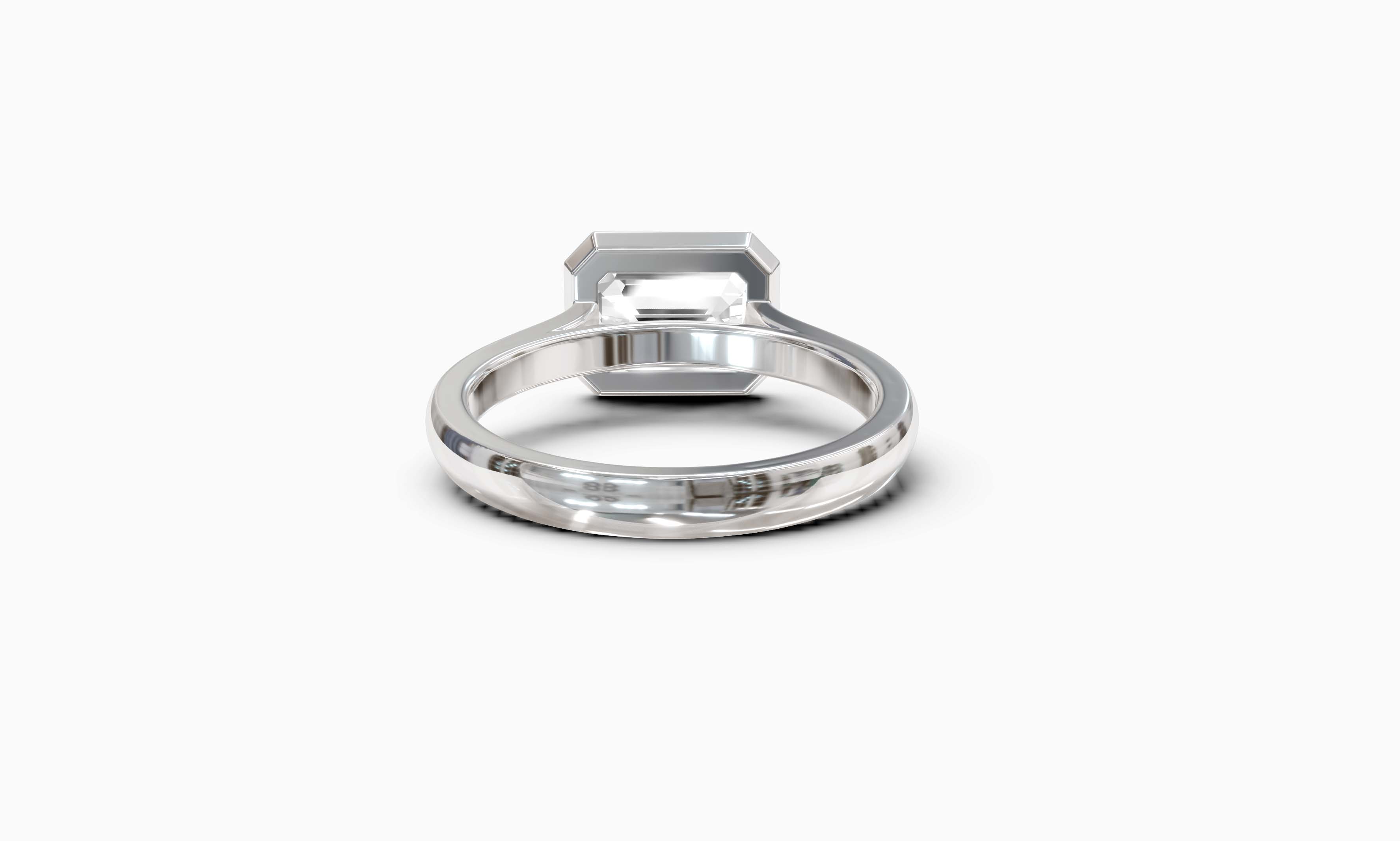 "It Girl" East-West Bezel Emerald Cut Solitaire Ring in White Gold