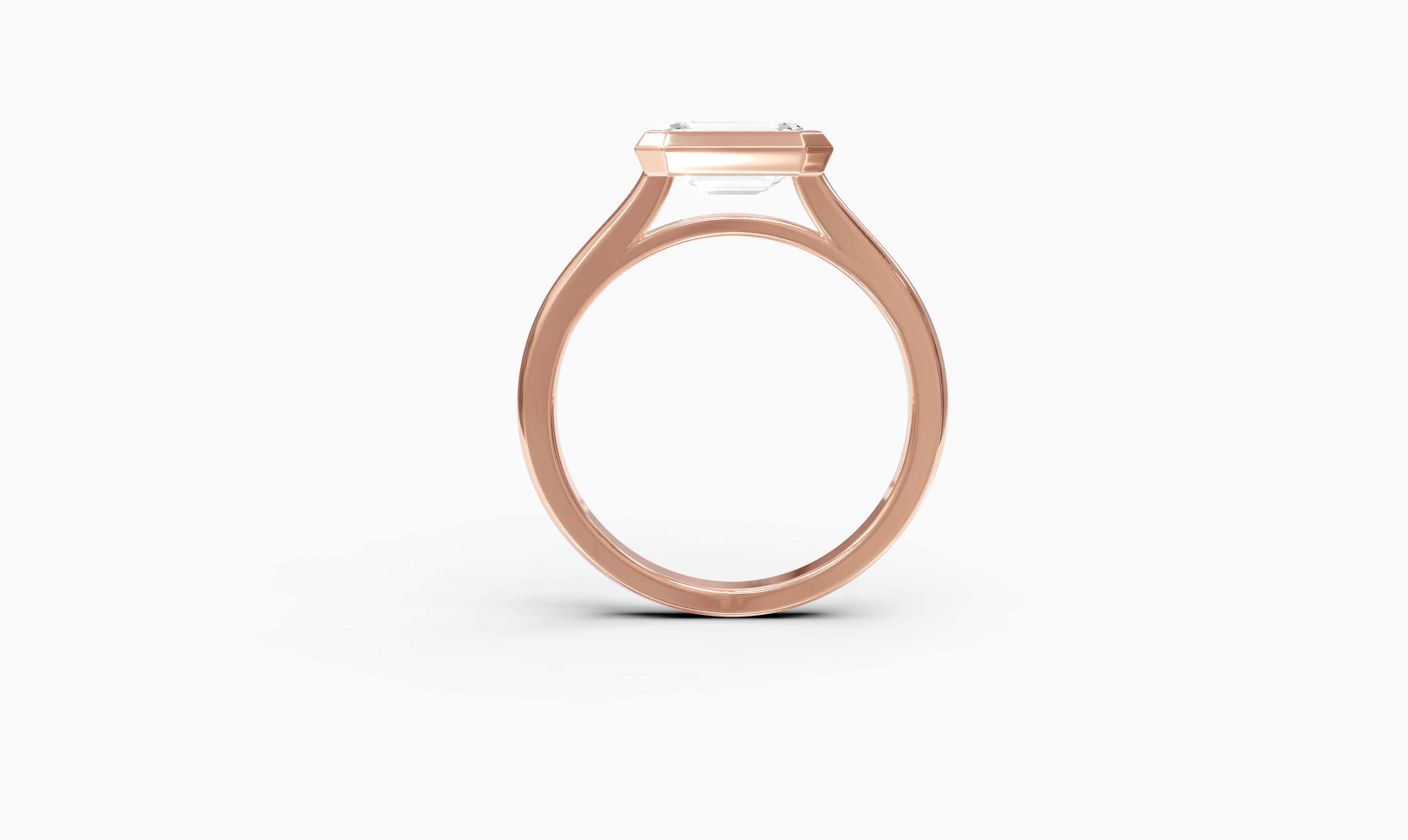 "It Girl" East-West Bezel Emerald Cut Solitaire Ring in Rose Gold