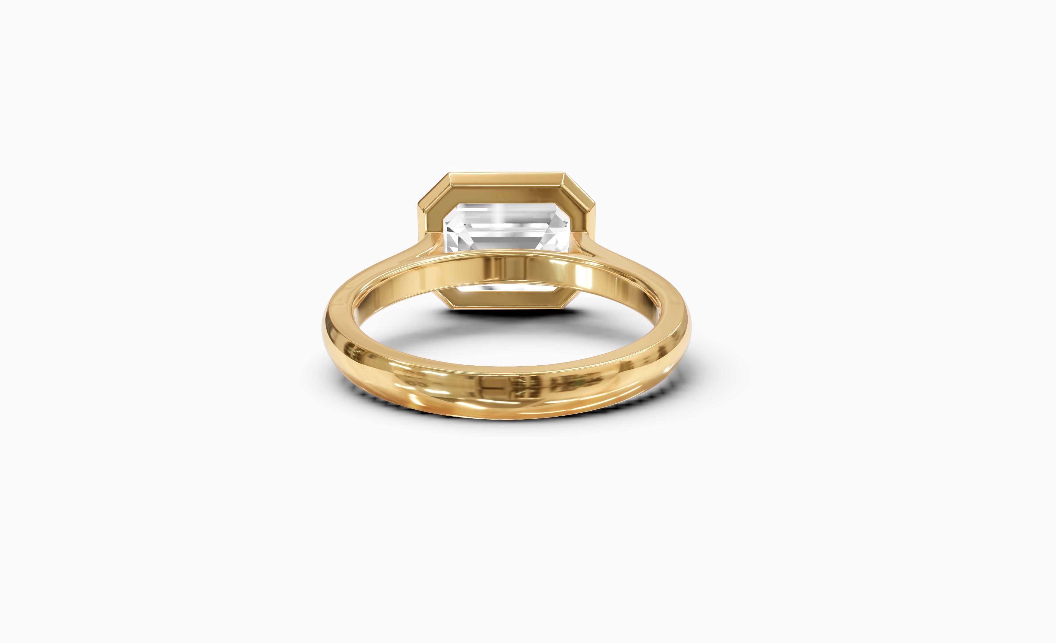 "It Girl" East-West Bezel Emerald Cut Solitaire Ring in Yellow Gold