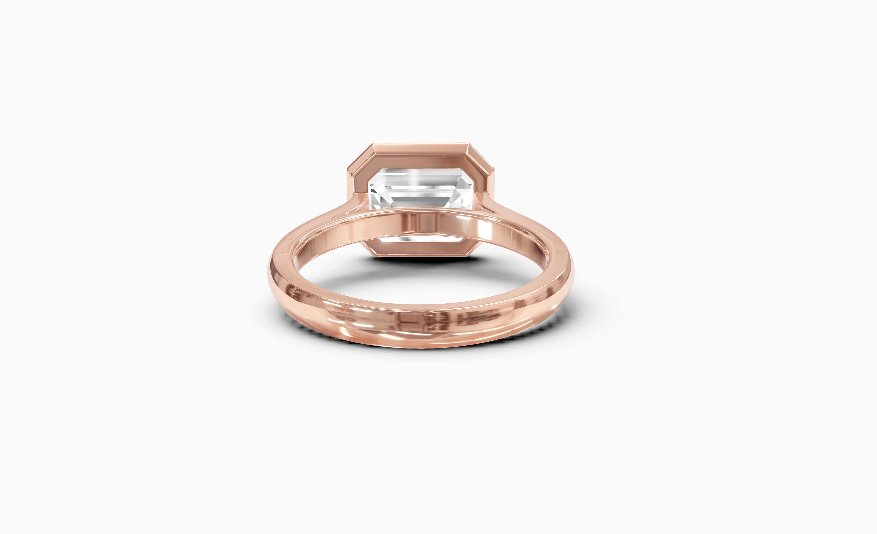"It Girl" East-West Bezel Emerald Cut Solitaire Ring in Rose Gold