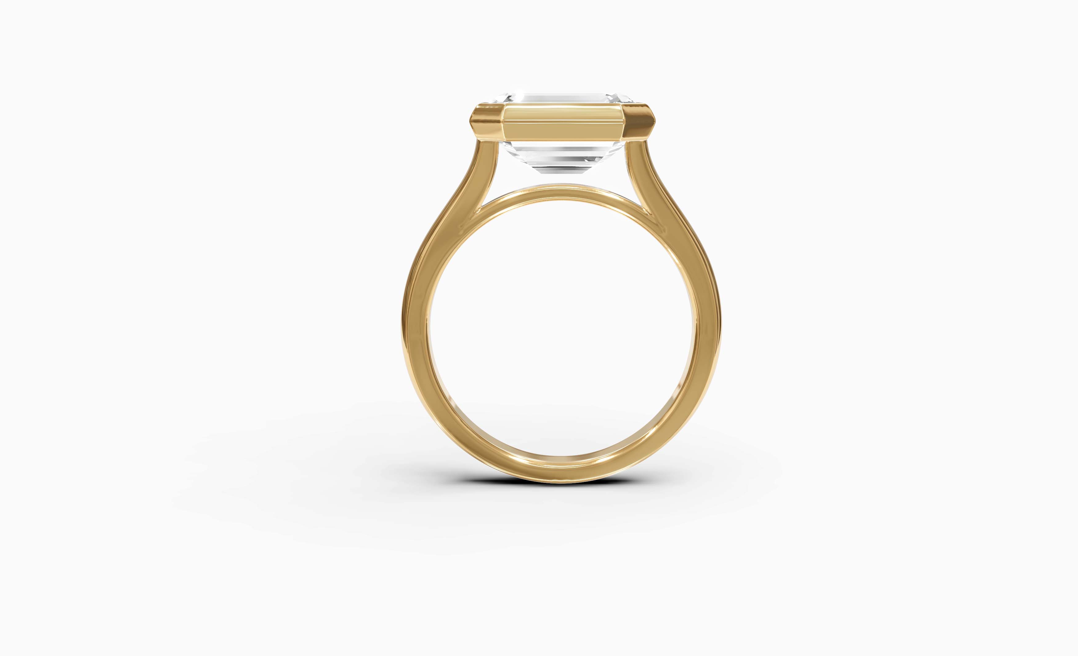 "It Girl" East-West Bezel Emerald Cut Solitaire Ring in Yellow Gold