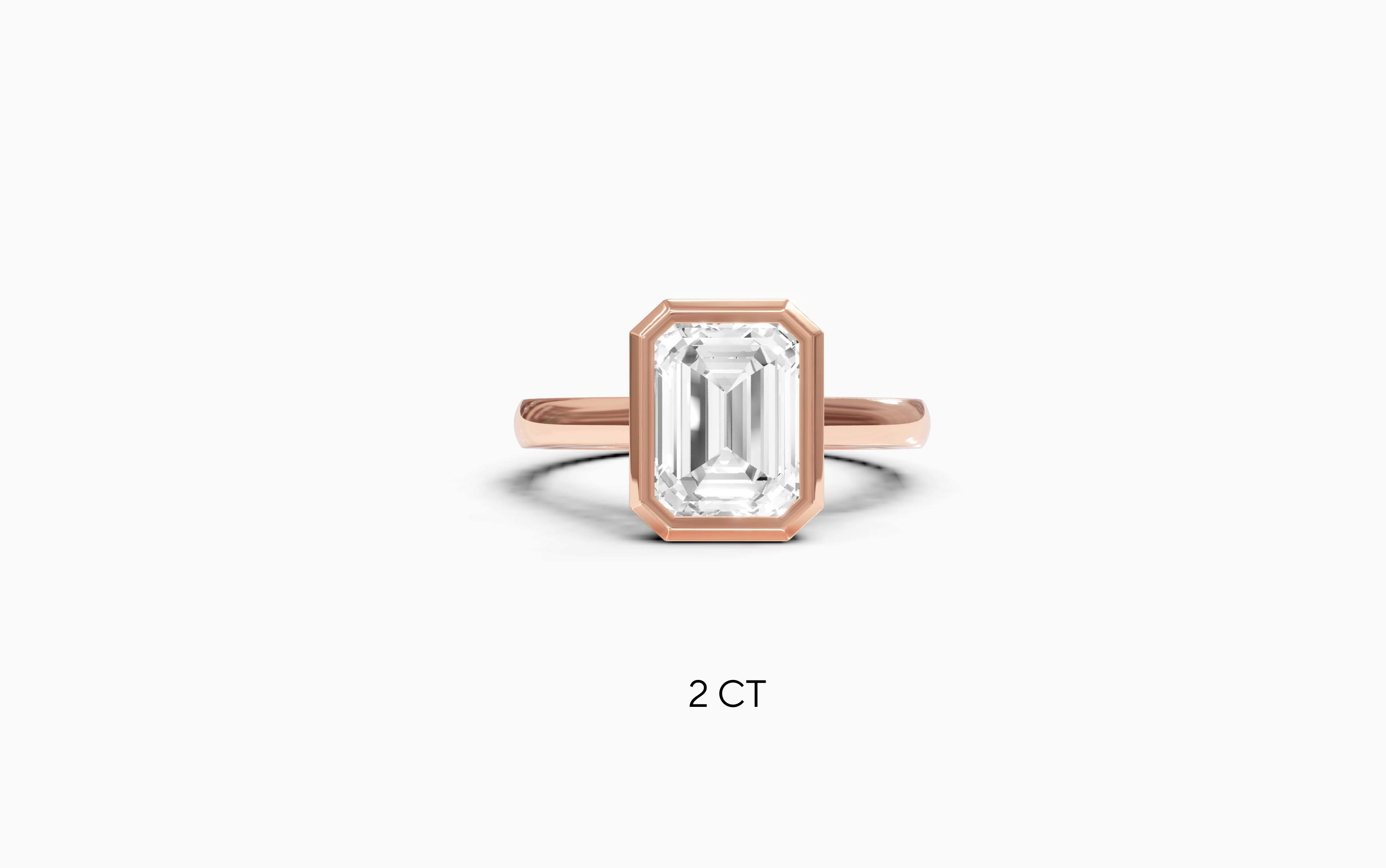 "It Girl" Bezel Emerald Cut Solitaire Ring in Rose Gold