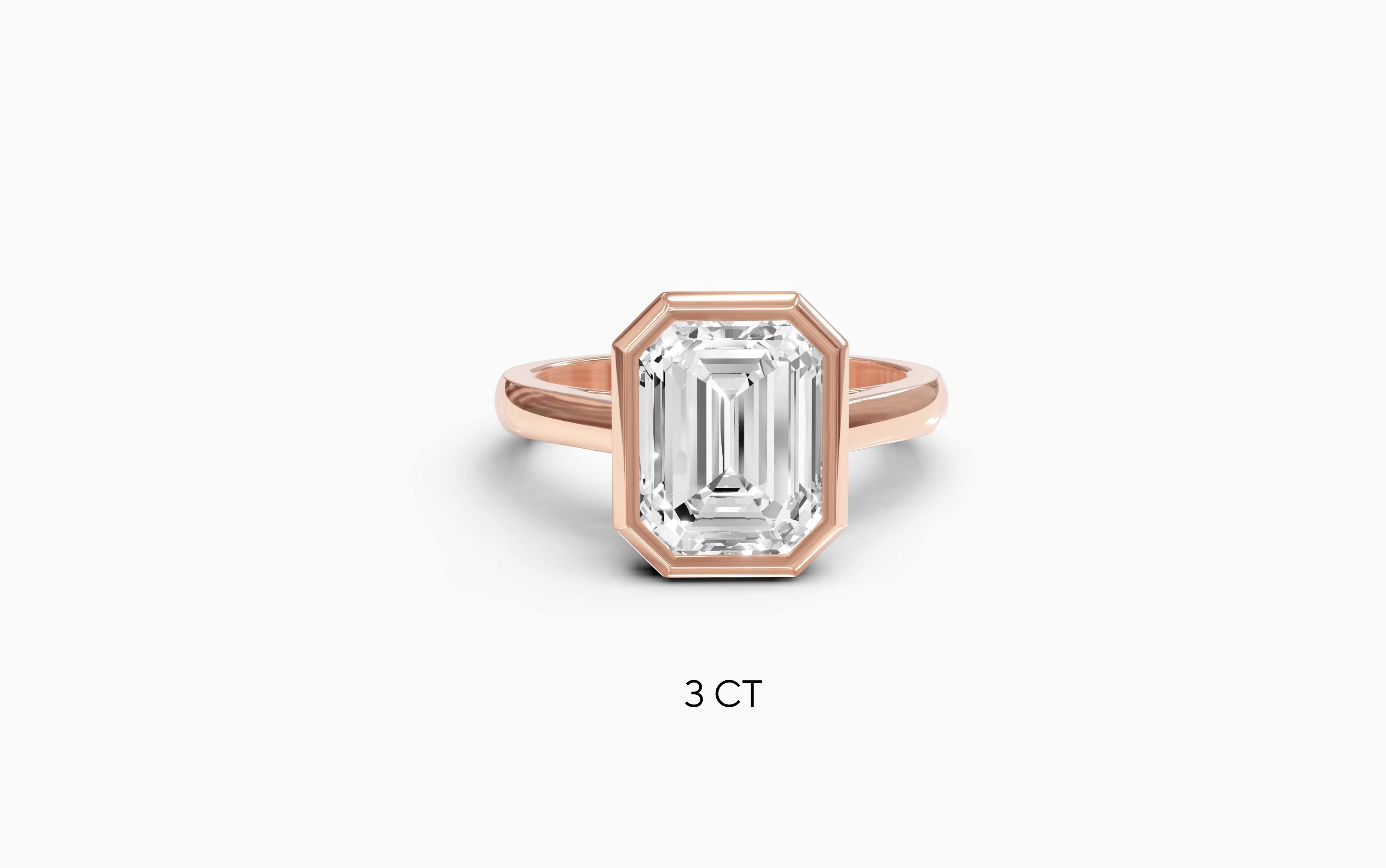 "It Girl" Bezel Emerald Cut Solitaire Ring in Rose Gold