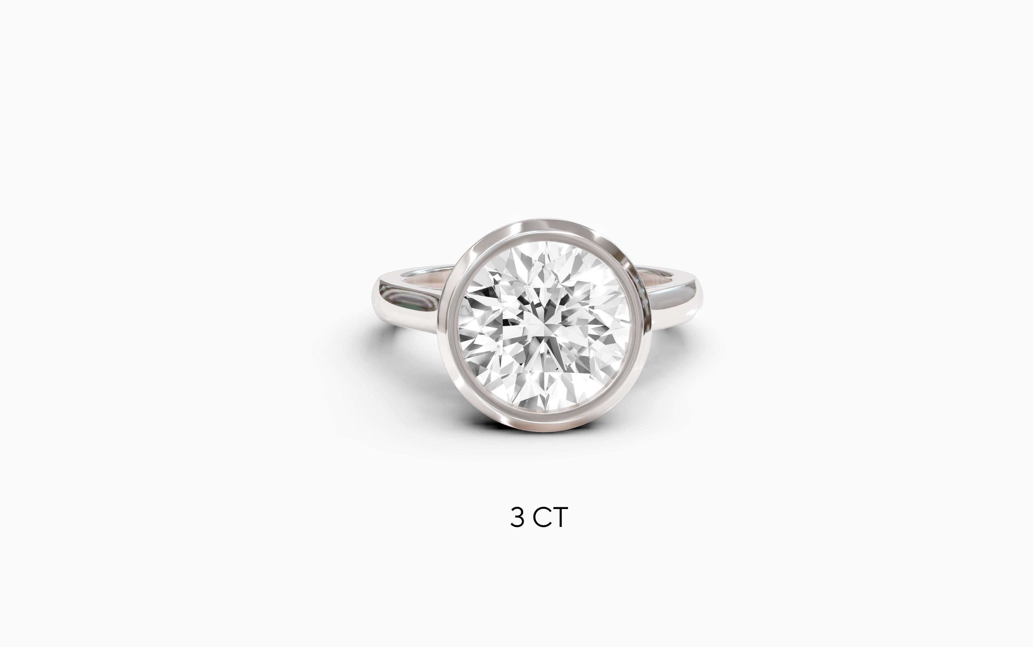 "Modern Perfection" Round Bezel Solitaire Ring in White Gold