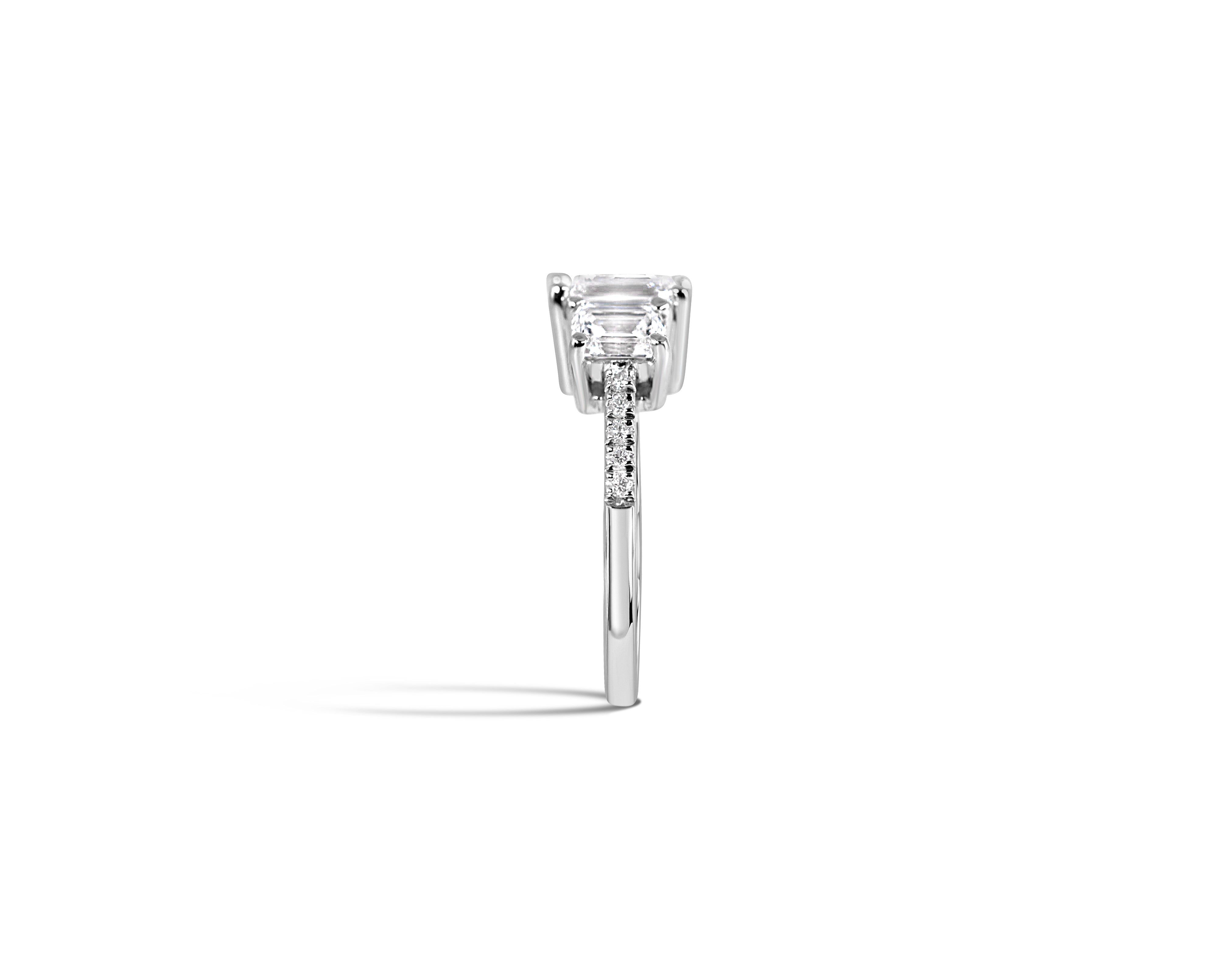 "Everything in Excess" Emerald Cut Three-Stone Ring with Pavé Band