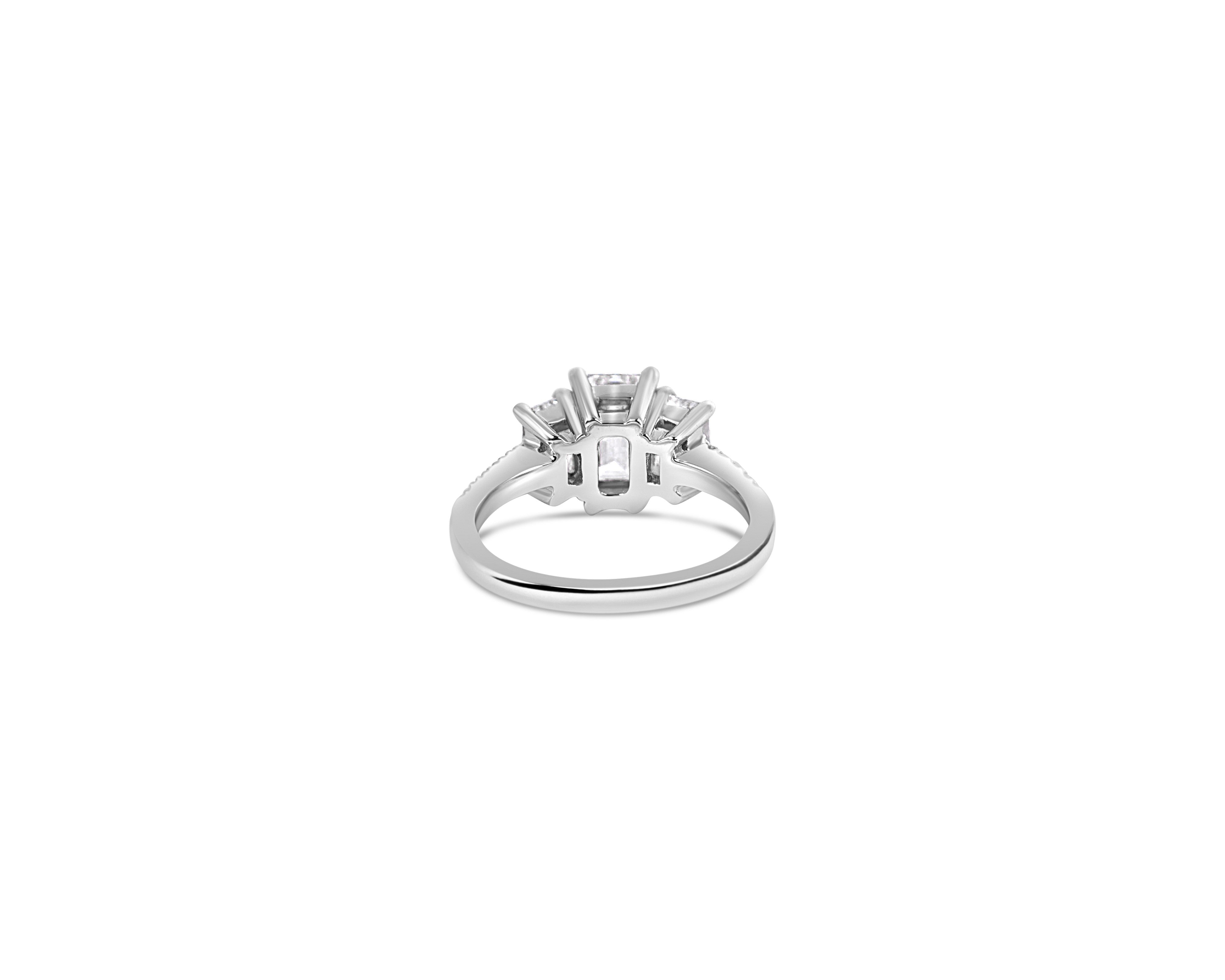 "Everything in Excess" Emerald Cut Three-Stone Ring with Pavé Band