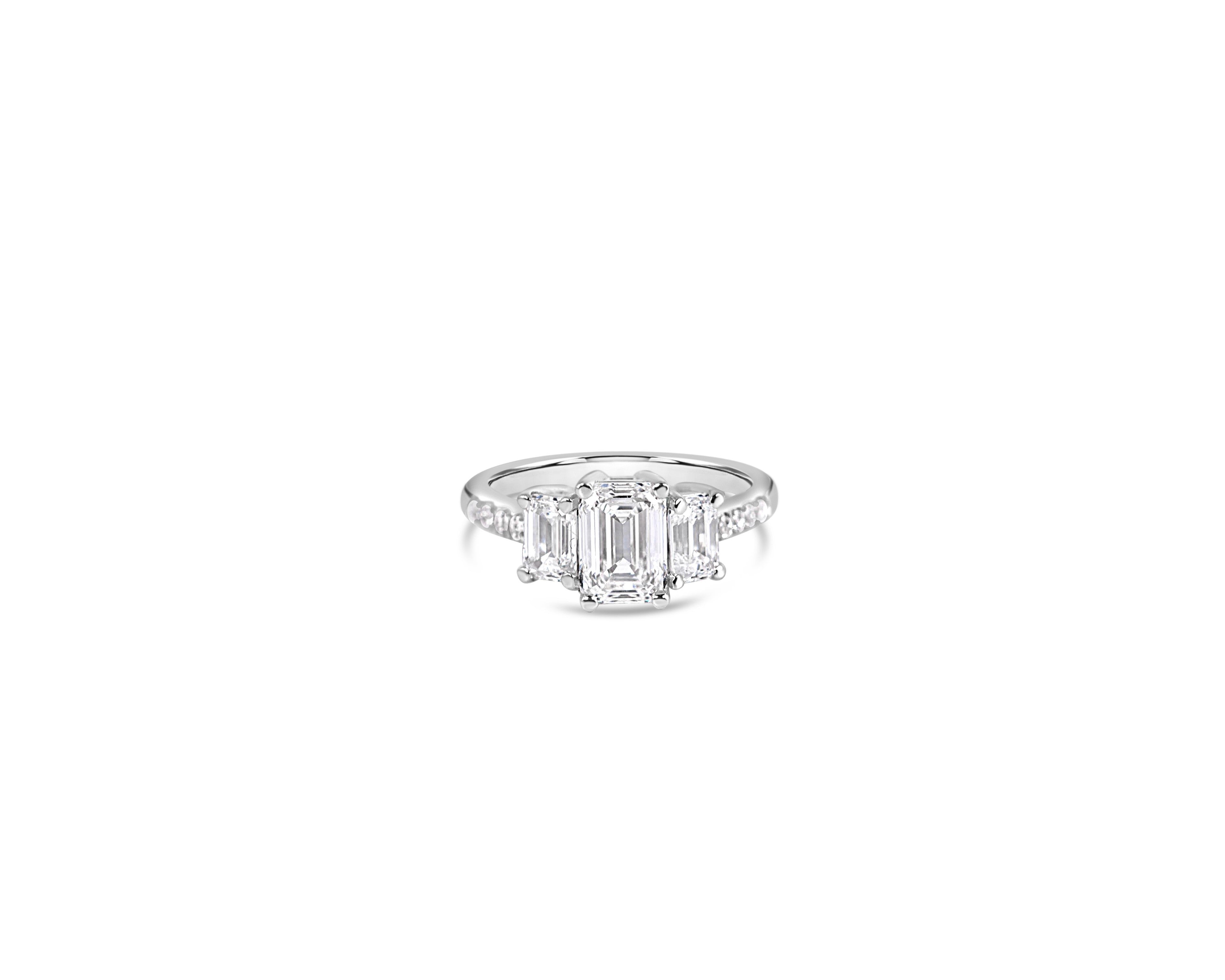 "Everything in Excess" Emerald Cut Three-Stone Ring with Pavé Band