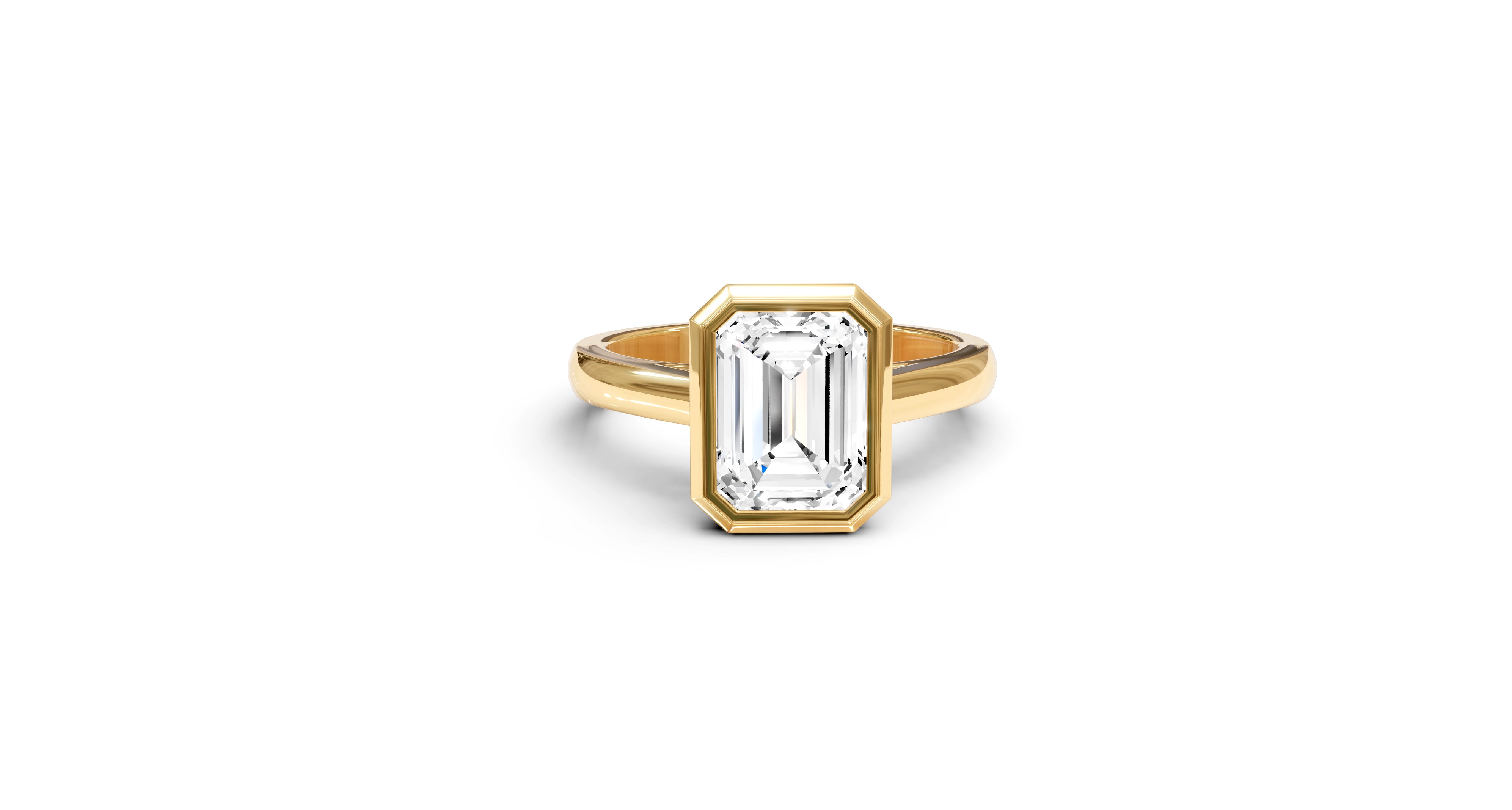 "It Girl" Bezel Emerald Cut Solitaire Ring in Yellow Gold