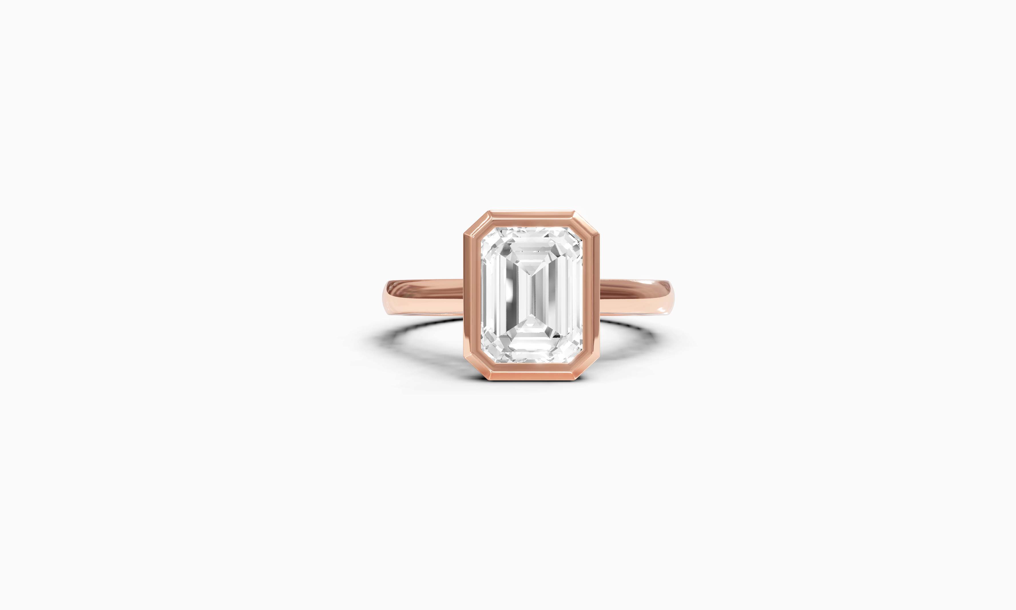 "It Girl" Bezel Emerald Cut Solitaire Ring in Rose Gold