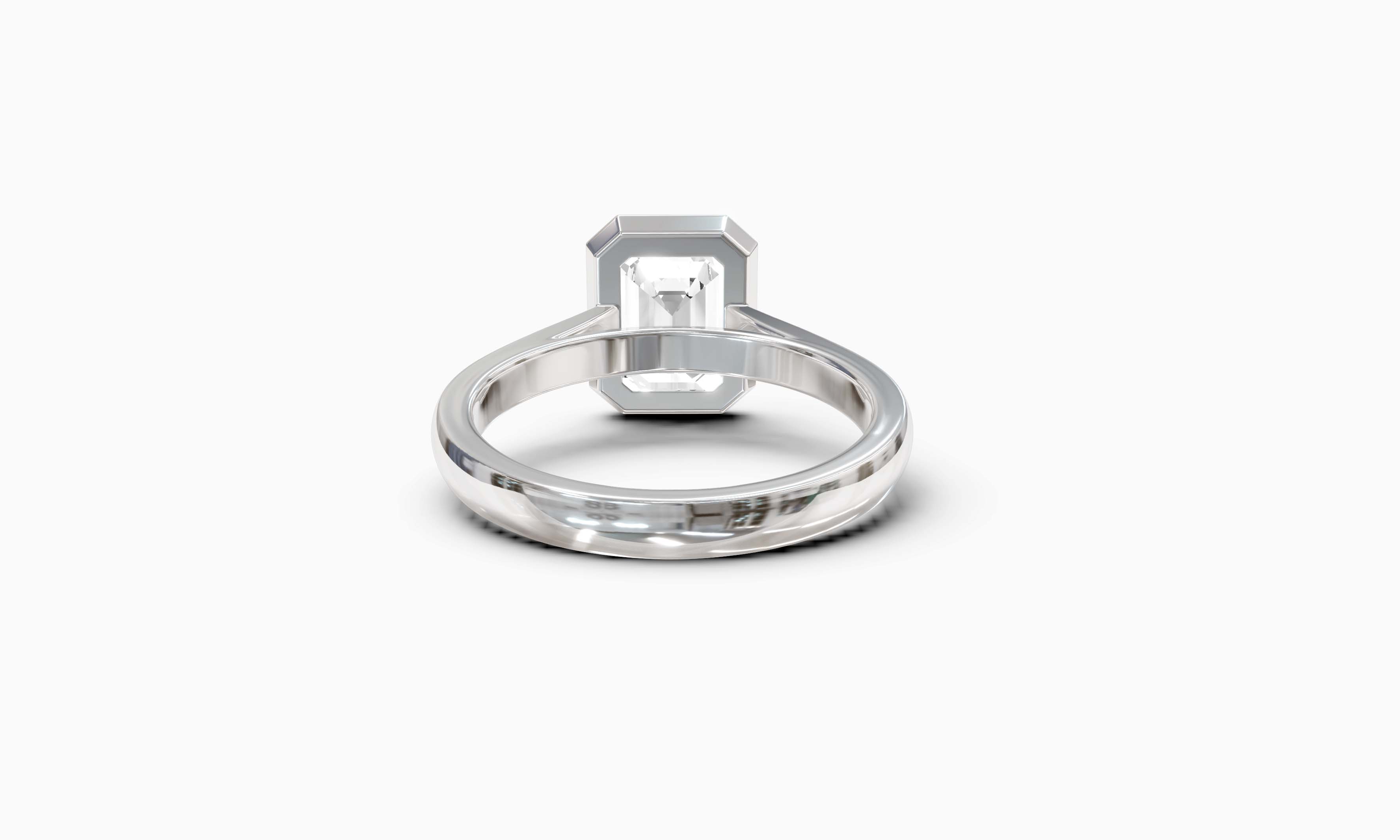 "It Girl" Bezel Emerald Cut Solitaire Ring in White Gold