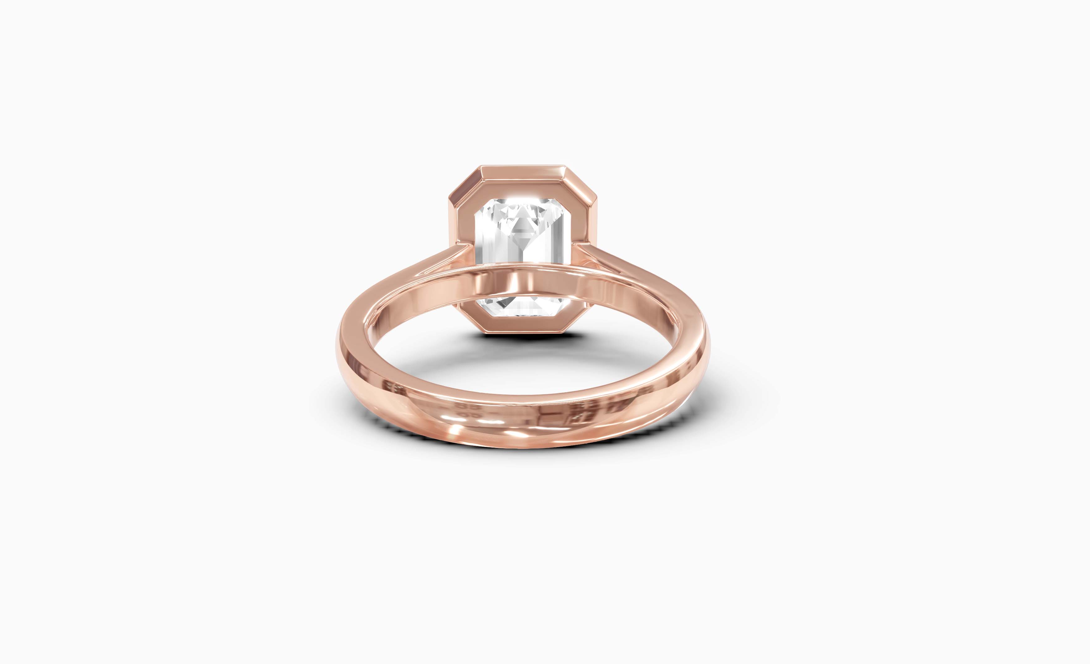 "It Girl" Bezel Emerald Cut Solitaire Ring in Rose Gold