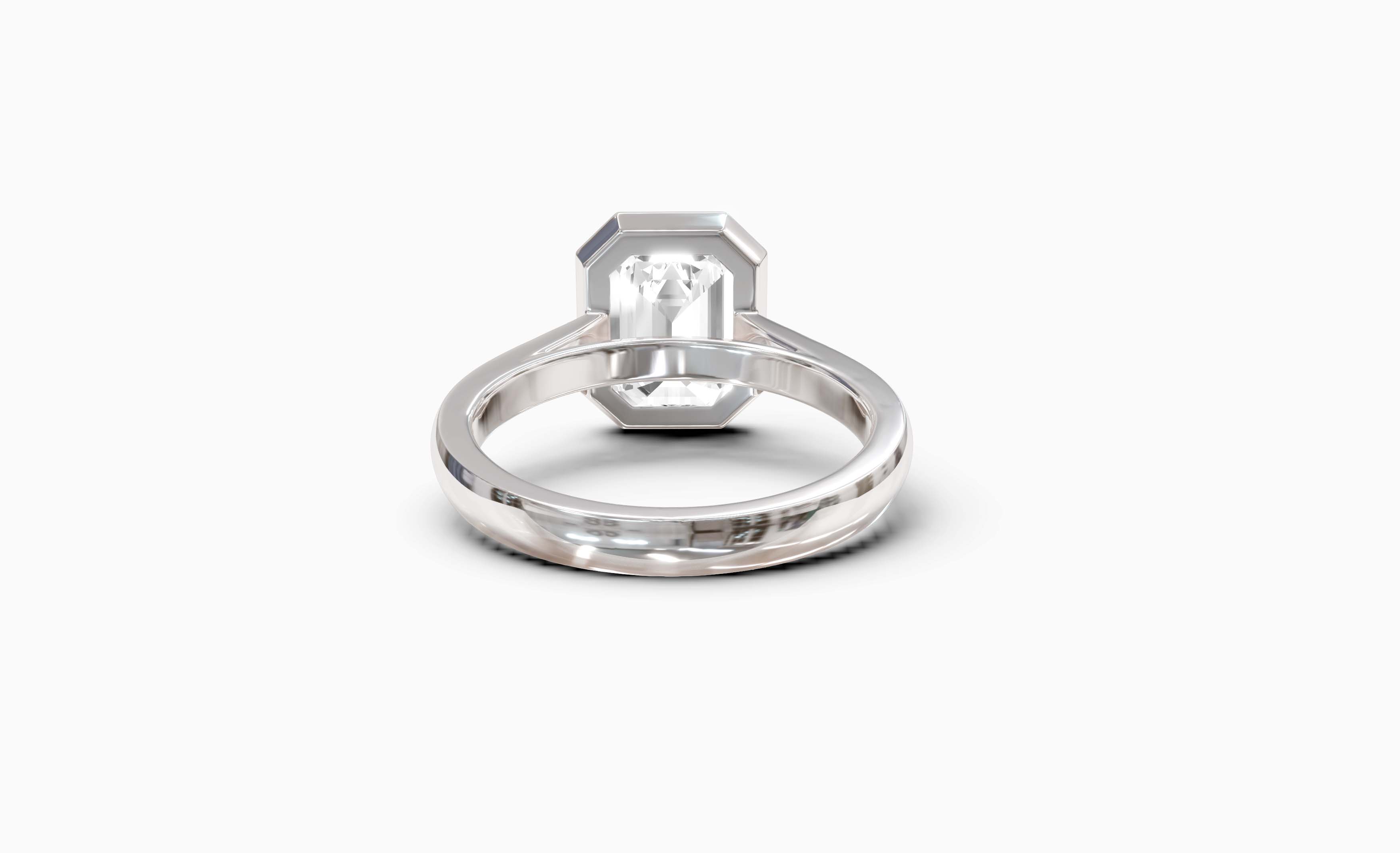 "It Girl" Bezel Emerald Cut Solitaire Ring in White Gold